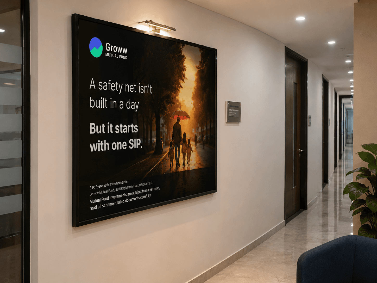 Branded wall creative covering an office wall with investor education messaging